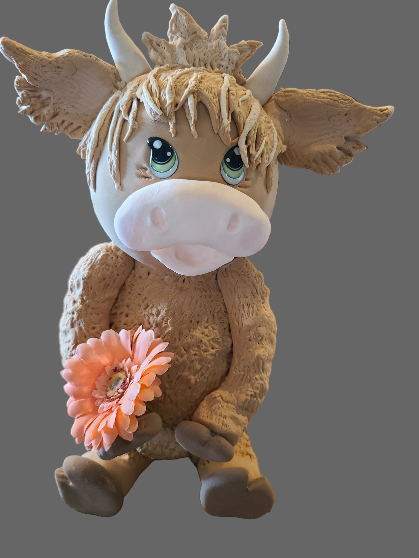 Highland cow with flower